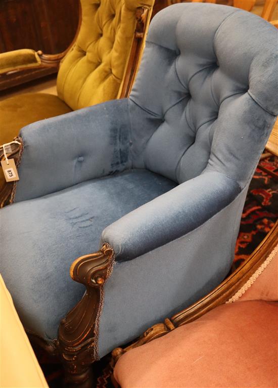 A Victorian walnut blue upholstered spoonback armchair